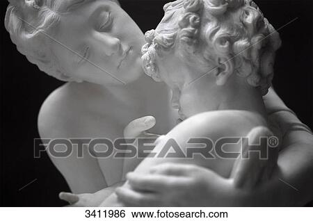 Stock Photograph - Marble statue of mother and son, close-up . Fotosearch