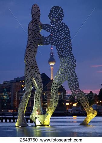 Stock Image - Molecule men sculptures in city, Spree River, Berlin, Germany . Fotosearch