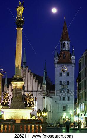 Stock Image - Monument lit up at city square, Mary Column, Marienplatz, Munich, Germany . Fotosearch