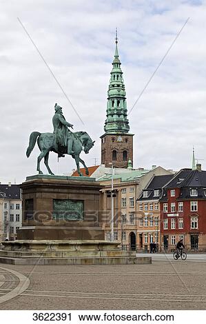 Stock Image - Nikolaus Church and equestrian statue on the Christiansborg Slotsplads in Copenhagen, Denmark . Fotosearch
