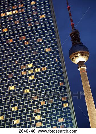 Office building and tv tower lit up at night, Alexanderplatz, Berlin, Germany View Large Photo Image Stock Photograph - Office building and tv tower lit up at night, Alexanderplatz, Berlin, Germany . Fotosearch