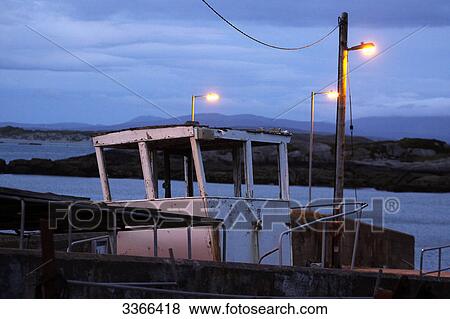 Old boat at a harbour, Leabgarrow, Arranmore Island, Ireland View Large Photo Image Stock Photo - Old boat at a harbour, Leabgarrow, Arranmore Island, Ireland . Fotosearch