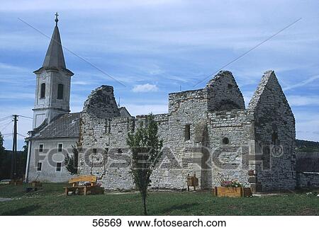 Stock Photo - Old ruins of a church against cloudy sky, Church Dorgice, Hungary . Fotosearch