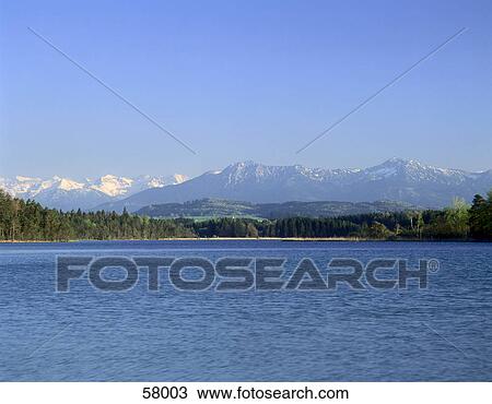 Panoramic view of lake under clear blue sky, Germany View Large Photo Image Stock Image - Panoramic view of lake under clear blue sky, Germany . Fotosearch