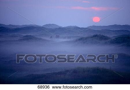 Panoramic view of mountain range at dusk, Texel Island, Netherlands View Large Photo Image Stock Photograph - Panoramic view of mountain range at dusk, Texel Island, Netherlands . Fotosearch