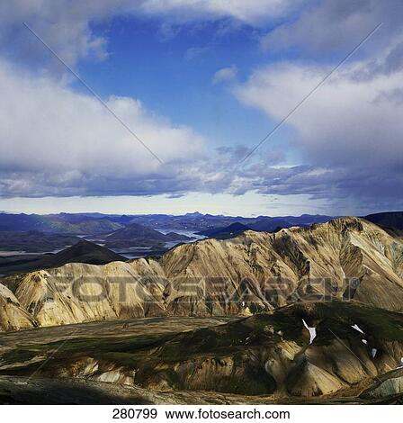 Stock Photo - Panoramic view of river with mountain range, Fjallabak Nature Reserve, Landmannalaugar, Iceland . Fotosearch