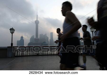 People jogging, Shanghai, China View Large Photo Image Picture - People jogging, Shanghai, China . Fotosearch