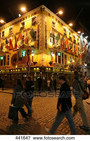 People walking in front of building lit up at night, Dublin, Republic of Ireland View Large Photo Image Stock Photo - People walking in front of building lit up at night, Dublin, Republic of Ireland . Fotosearch