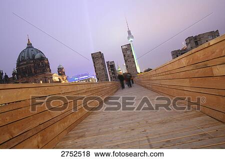 People walking on bridge in city View Large Photo Image Stock Photo - People walking on bridge in city . Fotosearch