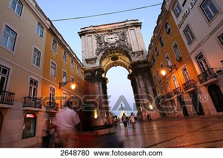 Stock Image - People walking on pedestrian area, Praca Do Comercio, Arco Da Rua Augusta, Lisbon, Portugal . Fotosearch