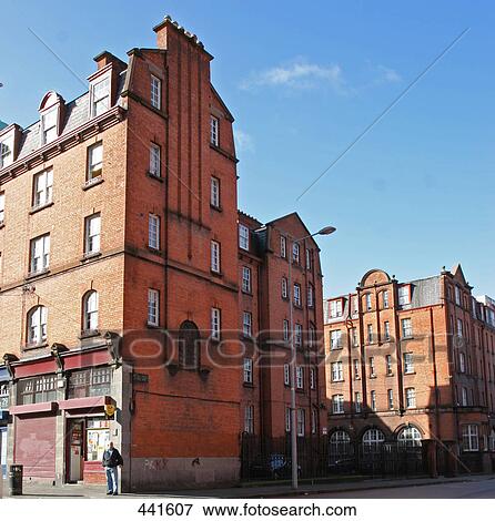 Stock Photo - Person standing in front of stores in city, Dublin, Republic of Ireland . Fotosearch