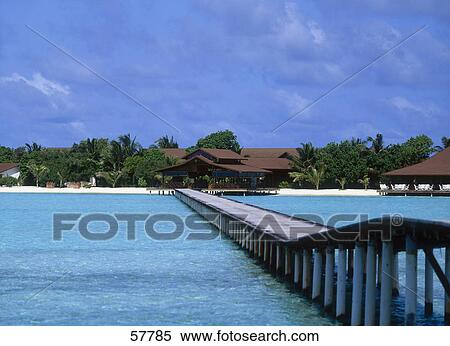 Stock Photography - Pier in the sea under cloudy sky, Dhigufinolhu, Maldives . Fotosearch