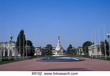 Stock Image - Pond in front of building under clear blue sky, Kiev, Ukraine . Fotosearch