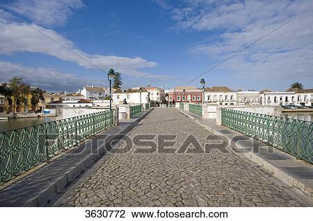 Stock Image - Ponte Romana above Rio Gilao, Tavira, Algarve, Portugal . Fotosearch