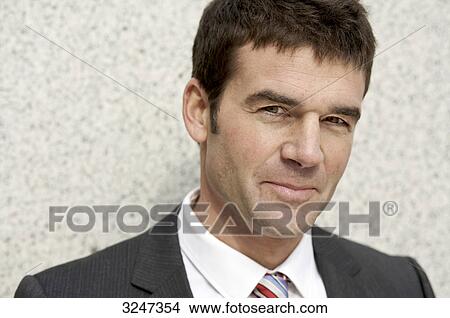 Picture - Portrait of an businessman, eye contact . Fotosearch