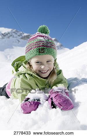 Portrait of girl smiling on snowcovered landscape View Large Photo Image Stock Image - Portrait of girl smiling on snowcovered landscape . Fotosearch