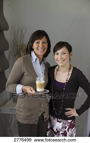 Portrait of woman and her daughter smiling View Large Photo Image Stock Photo - Portrait of woman and her daughter smiling . Fotosearch