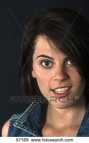 Portrait of young woman smiling View Large Photo Image Stock Photo - Portrait of young woman smiling . Fotosearch