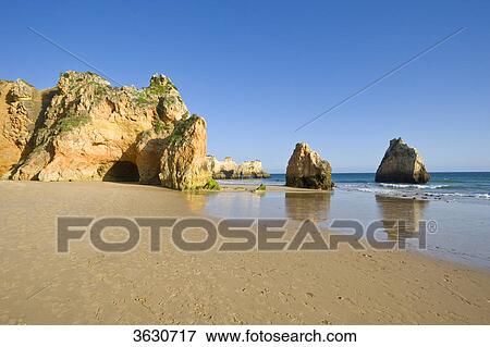 Stock Photo - Praia dos Tres Irmaos, Alvor, Algarve, Portugal . Fotosearch
