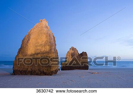 Stock Image - Praia dos Tres Irmaos at night, Alvor, Algarve, Portugal . Fotosearch