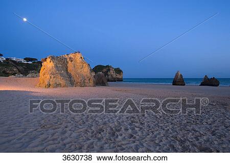Stock Photo - Praia dos Tres Irmaos at night, Alvor, Algarve, Portugal . Fotosearch