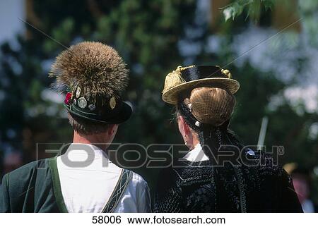 Stock Photograph - Rear view of couple in chiemgauer dress, Lake Chiemsee, Bavaria, Germany . Fotosearch