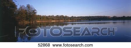 Reflection of trees in water View Large Photo Image Stock Photo - Reflection of trees in water . Fotosearch