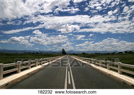 Stock Image - Road passing through landscape . Fotosearch