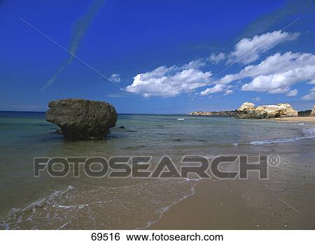 Stock Photograph - Rock formation on the beach, Praia da Rocha, Algarve, Portugal . Fotosearch