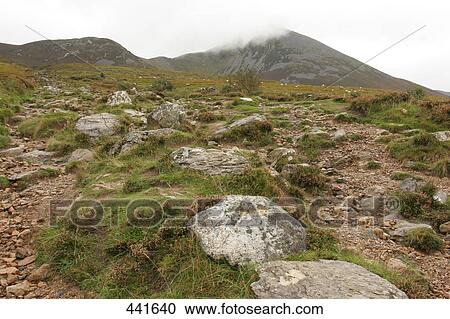 Stock Image - Rock formations on landscape, Croagh Patrick, County Mayo, Ireland . Fotosearch