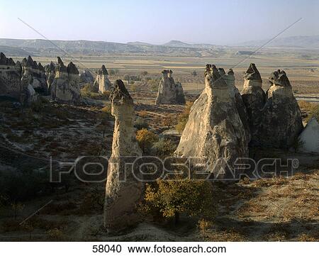 Rock formations on landscape, Valley Of The Fairy Chimneys, Goreme, Nevsehir Province, Cappadocia, Turkey View Large Photo Image Stock Image - Rock formations on landscape, Valley Of The Fairy Chimneys, Goreme, Nevsehir Province, Cappadocia, Turkey . Fotosearch