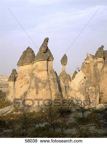 Rock formations on landscape, Valley Of The Fairy Chimneys, Goreme, Nevsehir Province, Cappadocia, Turkey View Large Photo Image Stock Photo - Rock formations on landscape, Valley Of The Fairy Chimneys, Goreme, Nevsehir Province, Cappadocia, Turkey . Fotosearch