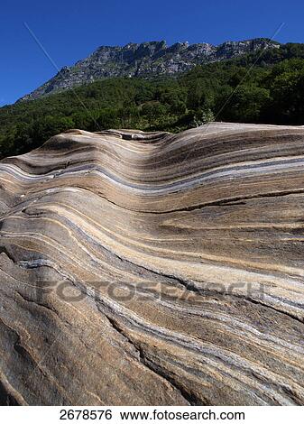 Stock Photograph - Rock formations on landscape, Verzasca Valley, Tessin Canton, Switzerland . Fotosearch