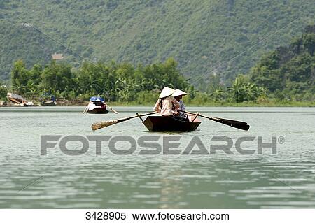 Stock Photography - Rowing boats on the Perfume River (Song Huong), Vietnam . Fotosearch