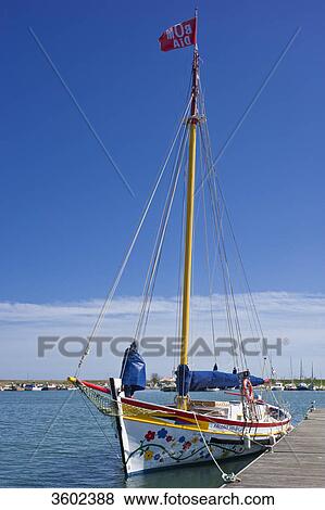 Stock Photo - Sailing boat in the harbor of Lagos, Algarve, Portugal . Fotosearch