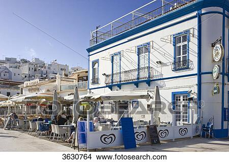 Seaside promenade with sidewalk cafe, Albufeira, Algarve, Portugal View Large Photo Image Picture - Seaside promenade with sidewalk cafe, Albufeira, Algarve, Portugal . Fotosearch