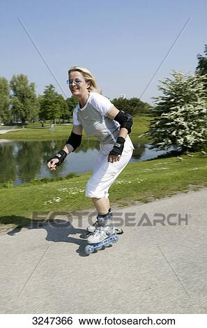 Stock Photograph - Senior woman inline skating, high size . Fotosearch