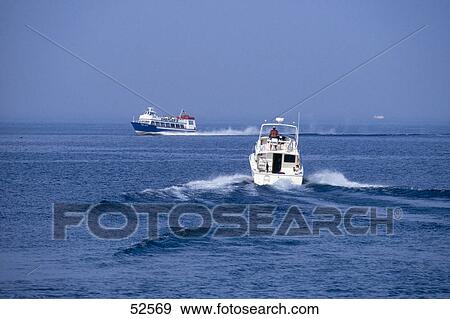Stock Photo - Ships in lake, Lake Huron, Mackinac Island, Michigan, USA . Fotosearch