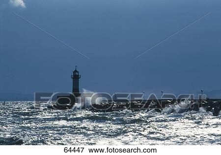 Stock Photo - Silhouette of a lighthouse on a coast, Arkona, Ruegen, Mecklenburg-Western Pomerania, Germany . Fotosearch