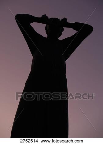 Silhouette of bronze statue of shouting man at dusk, Der Rufer, Tiergarten Berlin, Berlin, Germany View Large Photo Image Picture - Silhouette of bronze statue of shouting man at dusk, Der Rufer, Tiergarten Berlin, Berlin, Germany . Fotosearch
