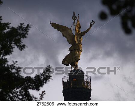 Silhouette of statue of angel on column at dusk, Victory Column, Tiergarten Berlin, Berlin, Germany View Large Photo Image Stock Photograph - Silhouette of statue of angel on column at dusk, Victory Column, Tiergarten Berlin, Berlin, Germany . Fotosearch