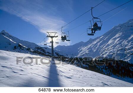 Ski lifts over snowy landscape, Obergural, Oetztal Alps, Tyrol, Austria View Large Photo Image Stock Photo - Ski lifts over snowy landscape, Obergural, Oetztal Alps, Tyrol, Austria . Fotosearch