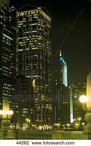 Skyscraper in city lit up at night, R. R. Donnelley Center, Wacker Drive, Chicago, Illinois, USA View Large Photo Image Stock Image - Skyscraper in city lit up at night, R. R. Donnelley Center, Wacker Drive, Chicago, Illinois, USA . Fotosearch