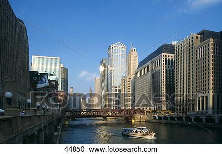 Stock Image - Skyscrapers along river, R. R. Donnelley Center, Wacker Drive, Chicago River, Chicago, Illinois, USA . Fotosearch