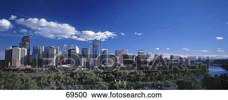 Stock Image - Skyscrapers at riverfront, Calgary, Albarta, British Columbia, Canada . Fotosearch
