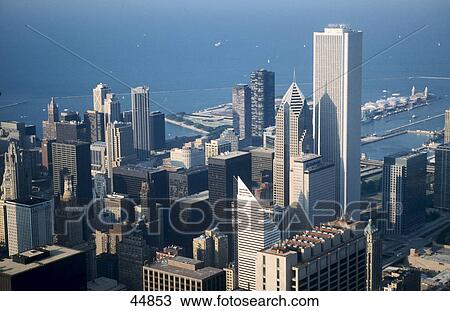 Skyscrapers in city with lake in background viewed from Sears Tower, Amoco Building, Lake Michigan, Chicago, Illinois, USA View Large Photo Image Stock Image - Skyscrapers in city with lake in background viewed from Sears Tower, Amoco Building, Lake Michigan, Chicago, Illinois, USA . Fotosearch