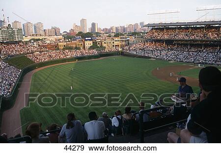 Spectators watching baseball game in stadium with city skyline in background, Wrigley Field, Chicago, Illinois, USA View Large Photo Image Stock Photo - Spectators watching baseball game in stadium with city skyline in background, Wrigley Field, Chicago, Illinois, USA . Fotosearch