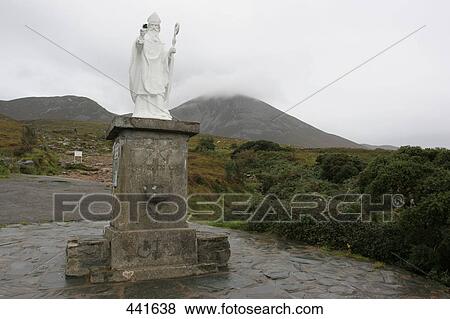 Stock Photo - St. Patrick's statue on pedestal, Croagh Patrick, County Mayo, Republic of Ireland . Fotosearch