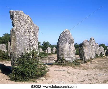Stock Image - Standing stones in field, Carnac, Morbihan, Brittany, France . Fotosearch
