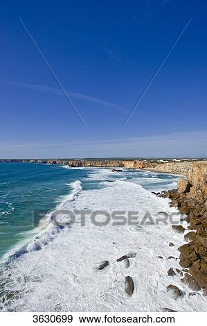 Stock Photo - Steep coast Cabo de Sao Vicente, Algarve, Portugal . Fotosearch